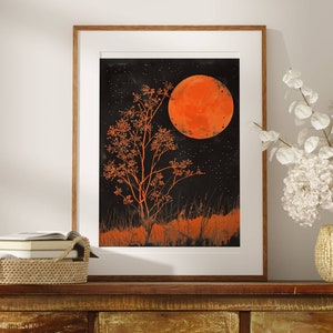 This gorgeous poster print features an illustration of an orange full moon above a matching orange tree, with orange grass  in the foreground. The sky is black and full of tiny stars.