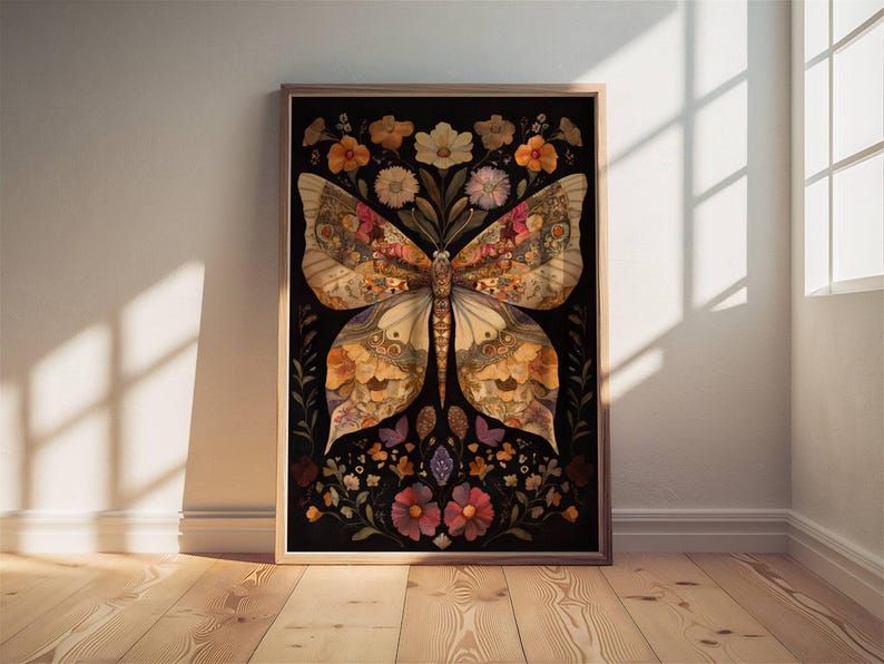 May include: A framed print of a butterfly made from pressed flowers and leaves. The butterfly is a light brown color with dark brown and black accents. The background is black and features a variety of flowers in shades of pink, purple, and yellow.