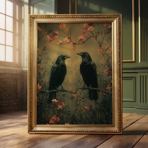 May include: A framed painting of two black crows perched on branches in a forest setting. The crows are facing each other and the background is a soft, muted green with pink flowers.
