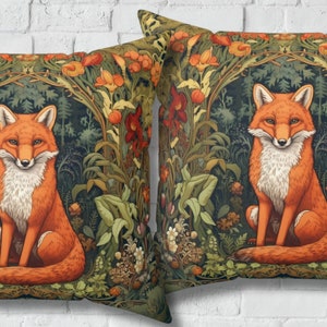 May include: Two decorative throw pillows with a fox sitting in a lush green forest with orange and red flowers. The fox is orange with a white chest and a bushy tail.