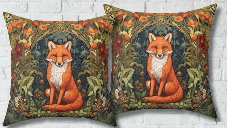 May include: Two decorative throw pillows with a fox sitting in a lush green forest with orange and red flowers. The fox is orange with a white chest and a bushy tail.
