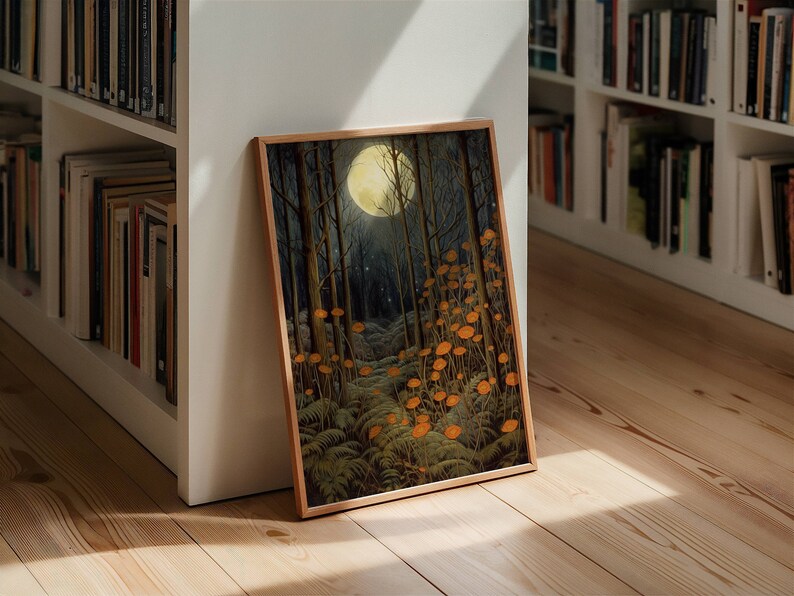 May include: A framed print of a moonlit forest scene with a full moon shining brightly in the sky. The forest floor is covered in a carpet of ferns and orange flowers.