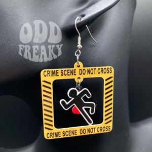 Love True Crime Shows? Check Out These Caution Tape and Body Outline Resin Earrings