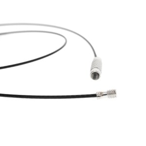 May include: A thin black cord necklace featuring a silver-toned metal screw-type clasp mechanism. The cord is flexible and circular, with one end showing a threaded male connector and the other end showing a matching female threaded cylinder.