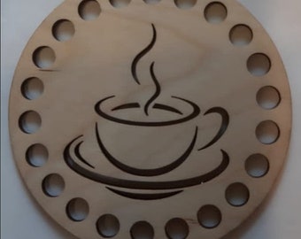 May include: A wooden yarn bowl with a coffee cup design and 18 holes around the edge.