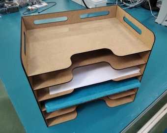 May include: A wooden desktop organizer with four tiers for holding papers and documents. The organizer is made of light brown wood and has a natural finish.