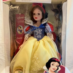 Snow White 16 inch porcelain doll with porcelain flower basket and stand