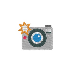 May include: Embroidered image of a gray camera with a black lens and a blue center. A bright orange and white starburst flash is on the left. A small red circle is on the lower left of the camera.