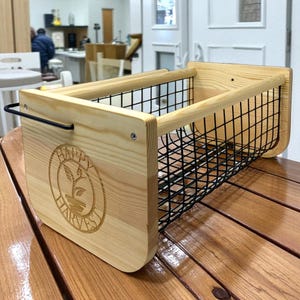 Bring farmhouse elegance to your garden with this Wooden Harvest Basket. Crafted with care, it features a rotating handle and sturdy build for carrying even heavy harvests. Use it for fresh veggies, herbs, or seasonal flowers. Beyond gardening, it doubles as rustic décor. Make it unique with custom engraving for weddings, housewarmings, or thoughtful gardener gifts.