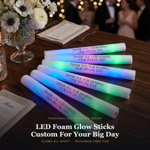 May include: A set of six cylindrical white LED foam glow sticks arranged in a fan pattern. Each stick features the black printed text "THANK YOU FOR SHARING OUR SPECIAL DAY" and emits a soft, multi-colored light glow along its length.