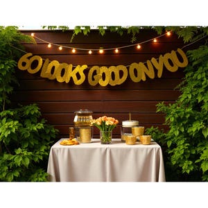 📦 What You’ll Receive
1 × “60 Looks Good on You” banner (letters + graphic)

1 × 9 ft glitter twine, pre-threaded

2 × satin ribbon ends (for hanging)

1 × care/storage envelope

Optional: add-on “Sixty & Fabulous” foil stripe for extra flair

🎁 Why It’s a Customer Favorite
Hangs instantly, no fuss—guests rave about how quickly it brightens the party.

Sturdy & reusable—many buyers reuse them every year .

Picture-perfect size—ideal for backdrops, mantles, tables, porches.