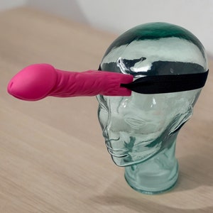 Strap on the pink cowgirl hat, grab your rings, and aim for the wiggling "henparty gift" on your friend's head. This is not your average never-have-i-ever or dirty drinking game—it's a one-of-a-kind ladies night game that guarantees