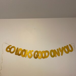 60th birthday banner

sixty birthday banner

60 looks good on you

60th party decor

60th birthday sign

milestone birthday sign

prestrung party banner

glitter birthday decor

birthday banner for her

birthday banner for him

sixty party decoration

60th birthday garland

60th birthday supplies