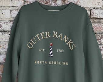 Sudadera con diseño del faro de Outer Banks, Carolina del Norte, ideal como regalo o recuerdo de viaje.