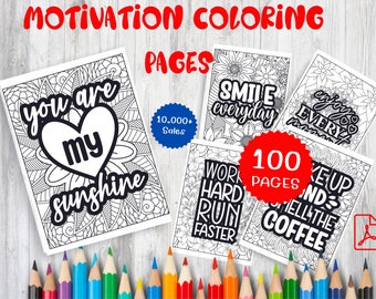 May include: A set of 100 motivational coloring pages featuring positive affirmations and inspirational quotes. The pages are black and white and feature intricate designs. The text includes "You are my sunshine", "Smile everyday", "Enjoy every moment", "Work hard run faster", and "Wake up and smell the coffee".