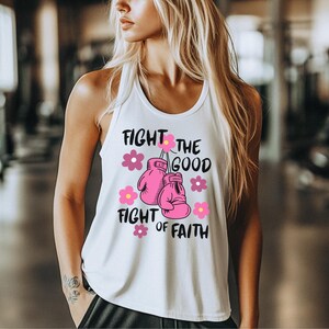 May include: White tank top with a pink boxing glove graphic and the text "Fight the good fight of faith".
