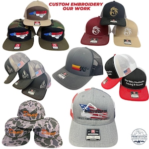 May include: A collection of custom embroidered trucker hats in various colors, including camo, gray, and red. The hats feature logos and text such as "SFC", "PCI", and "Barrett Pumping". The text "Custom Embroidery Our Work" is also visible.
