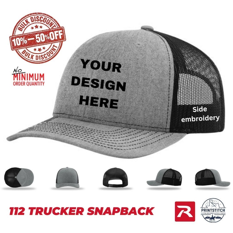 May include: A gray trucker snapback hat with a black mesh back. The hat features the text "YOUR DESIGN HERE" and "Side embroidery". Additional hats are shown below the main hat. The image also includes text that says "BULK DISCOUNT 10%-50% OFF" and "No MINIMUM ORDER QUANTITY".