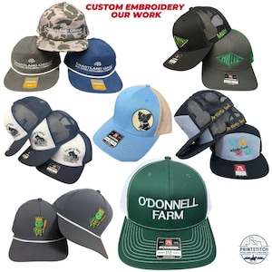 May include: A collection of custom embroidered baseball caps in various colors and designs. The caps feature logos, text, and graphics, including "Coastland Group," "O'Donnell Farm," and a bulldog. The image also includes the text "Custom Embroidery Our Work."