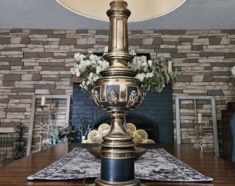 1960s Hollywood Regency Brass Stiffel Lamp with Acanthus Leaf Details and Black Enamel Accents.