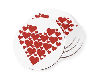 May include: Set of six white round coasters with a red heart design. The hearts are arranged in a pattern to form a larger heart shape.