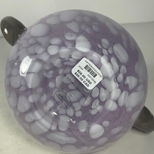 May include: A purple glass bowl with white speckles and two grey handles. The bowl is labelled "Anthropologie" and has a price tag of &pound;58.00 and &pound;68.00.