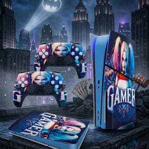 May include: A gaming console and controllers featuring a Harley Quinn design. The controllers and console have a blue and red color scheme with the word "GAMER" on the console. The background shows a cityscape with a Batman symbol.