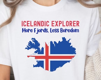 May include: White t-shirt with the text "Icelandic Explorer More Fjords, Less Boredom" and a graphic of the outline of Iceland with the Icelandic flag colors.