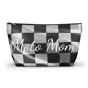 May include: Black and white checkered cosmetic bag with the text "Moto Mom" in white cursive font.