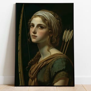 May include: A framed portrait of a woman with long, wavy brown hair, wearing a white headband and a green and brown draped garment. She holds a bow and has arrows over her shoulder. The artwork has a classical style.