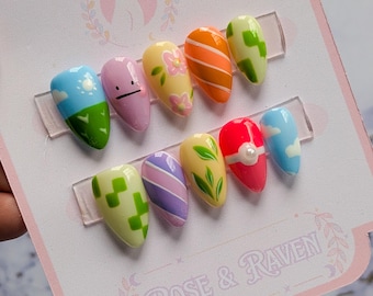 Uñas personalizadas hechas a mano y pintadas a mano inspiradas en el videojuego Poke