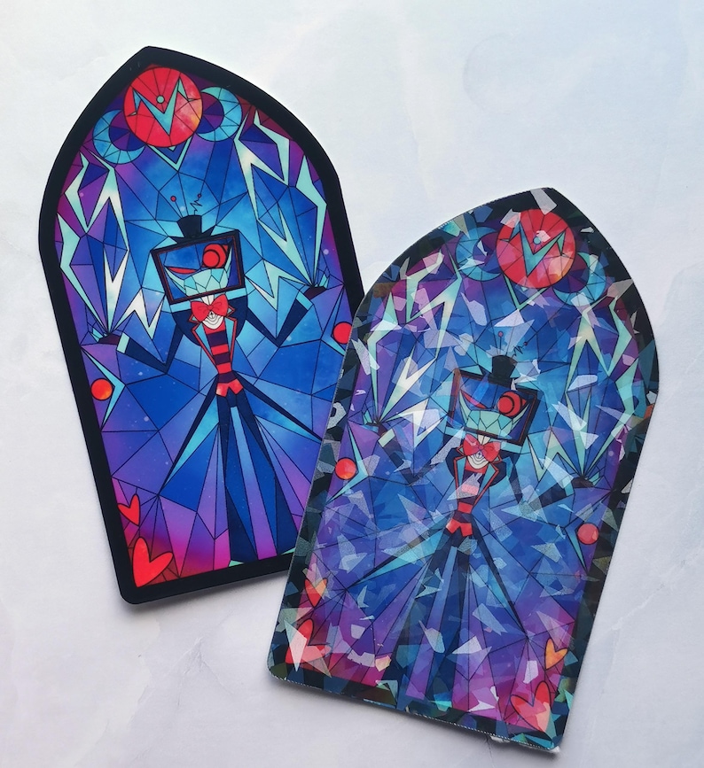 May include: Two stained glass style stickers featuring a cartoon character with a red face, black hat, and a television screen for a head. The character is surrounded by blue, purple, and red geometric shapes. The stickers are shaped like arched windows.