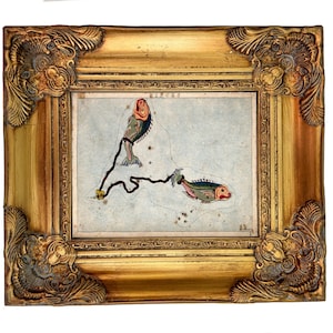 May include: A framed illustration of the Pisces constellation featuring two stylized fish connected by a dark line on a light blue background. The word PISCES is printed at the top. The frame is ornate, metallic gold with decorative corner details.