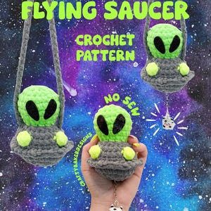 May include: A crochet pattern for a flying saucer featuring a lime green alien with black eyes inside a gray saucer. The text reads FLYING SAUCER CROCHET PATTERN NO SEW. A small cow charm hangs from the bottom of the saucer on a silver chain.