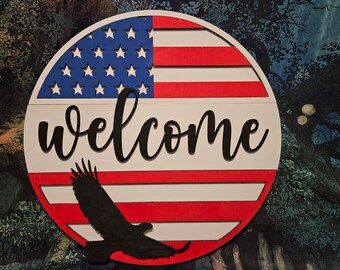 Patriotic 4th of July welcome door hanger sign with American flag stars and stripes and eagle