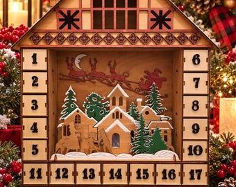 May include: A wooden advent calendar shaped like a house with twenty-four numbered drawers. The center features a layered scene with a village, evergreen trees, and a silhouette of a sleigh with reindeer and a crescent moon against a light wood.