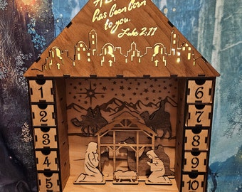 Lighted Christmas advent calendar with nativity scene with drawers to hide treats for each day