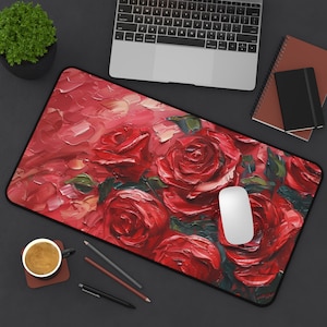 May include: A rectangular mouse pad featuring a vibrant oil painting of red roses. The artwork has a textured, impasto style with visible brushstrokes. The pad has a black border and is designed for use with a computer mouse.