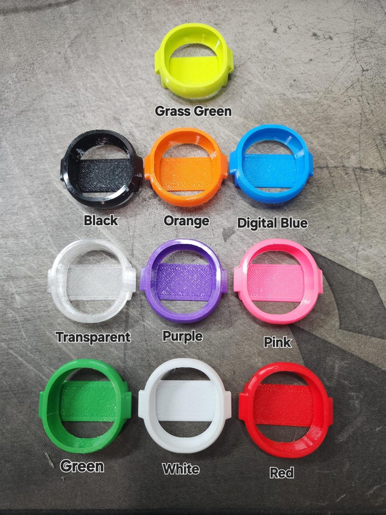 Puede incluir: Surtido de 10 cubiertas redondas para correas de reloj en varios colores, incluyendo negro, naranja, azul digital, transparente, morado, rosa, verde, blanco, rojo y verde hierba.