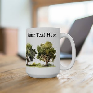 May include: White ceramic mug with a watercolor illustration of three trees. The mug has a handle and the text "Your Text Here" printed on the front.