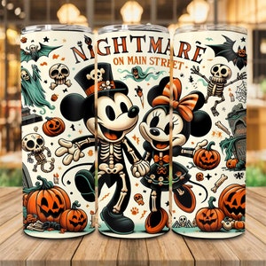 May include: Three stainless steel tumblers with a Halloween-themed design. The design features Mickey and Minnie Mouse dressed as skeletons, pumpkins, ghosts, bats, and the text "Nightmare on Main Street". The tumblers are on a wooden surface.
