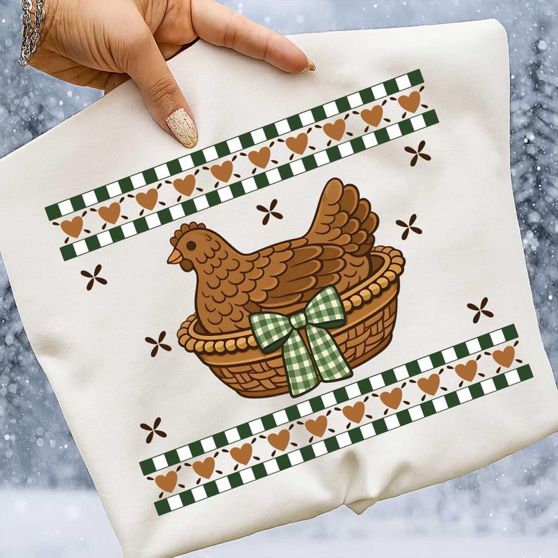 May include: White square cushion featuring a brown hen in a woven basket, adorned with a green gingham bow. The design includes brown hearts, green and white checkered borders, and small brown cross shapes.