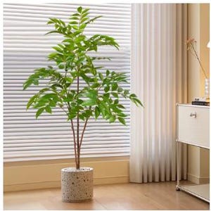 May include: A large artificial plant with green leaves in a white and grey concrete pot. The plant is in a room with a window and white blinds.