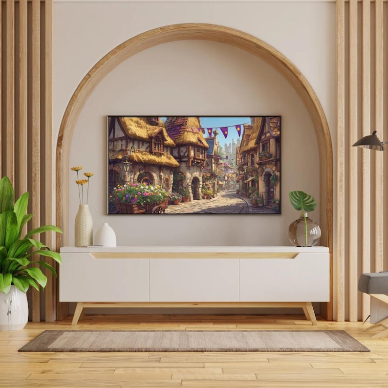 May include: A white entertainment center with wooden legs and a light wood trim. A large flat-screen TV displays a painting of a European village. The room features a wooden arch, vertical wood paneling, and decorative plants.
