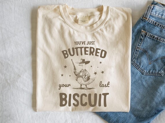 Funny Goose T-shirt: You've Buttered Your Last Biscuit, Cowboy Raccoon Sheriff