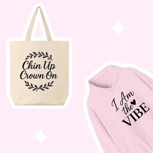 May include: A set of two items: a beige tote bag with the text "Chin Up Crown On" and a pink hoodie with the text "I Am the Vibe" and a small heart.