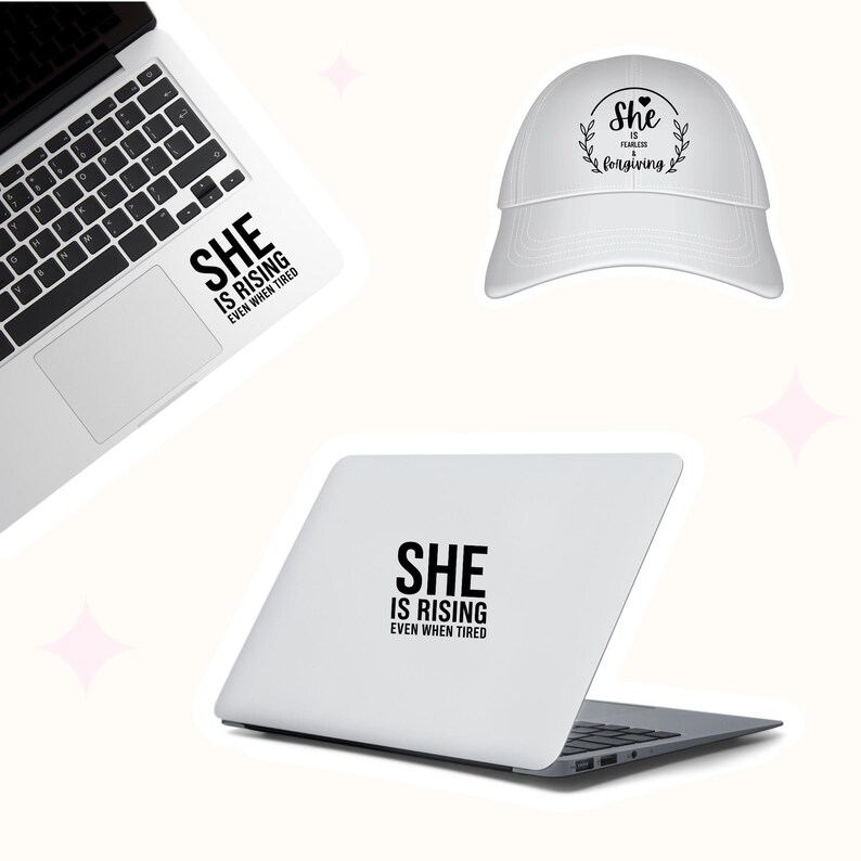May include: A white laptop and a white baseball cap with the text "She is Rising Even When Tired" and "She is Fearless, Forgiving". The laptop has a sticker with the same text.