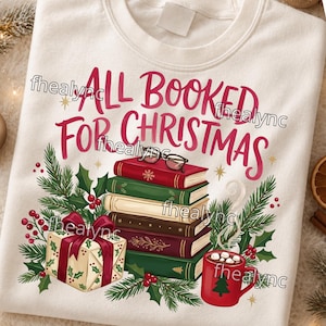 May include: A cream-colored sweatshirt featuring the red text ALL BOOKED FOR CHRISTMAS above a stack of five books, a pair of glasses, a gift box with a red bow, a red mug with marshmallows, and green pine branches with red berries.