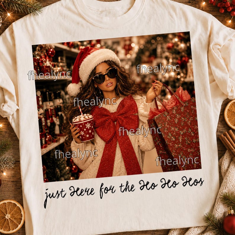May include: A cream-colored t-shirt featuring a graphic of a person in a Santa hat and sunglasses holding a red cup and a gift bag, with a large red bow on their sweater. The text "just Here for the Ho Ho Hos" is printed below the graphic.
