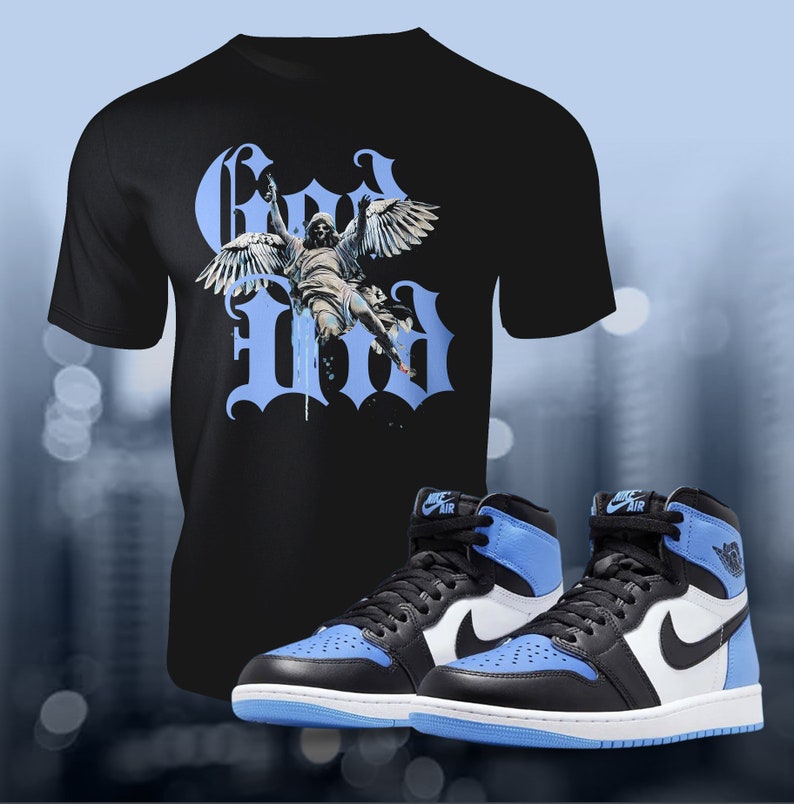 May include: A black t-shirt featuring a graphic of a winged figure and the text "God Did" in blue and white. A pair of black and blue high-top trainers with a white swoosh and the text "Nike Air" on the side.
